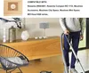 A person is vacuuming in a living room with a wooden cabinet and decorative items. Produktbild-Vorschau