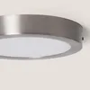 A close-up view of a round LED ceiling light with a brushed metal frame and a white diffuser. Produktbild-Vorschau