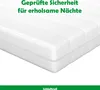 A close-up view of a white mattress.