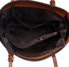 The inside of a brown leather handbag. Produktbild-Vorschau