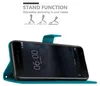 A teal flip case for a smartphone, shown in a stand-up position. The phone screen displays the time and date. Náhled obrázku produktu