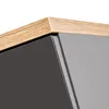 A close-up view of the corner of a cabinet, showing the edge of a wooden top and a gray glossy surface. Produktbild-Vorschau
