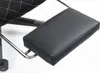 A close-up view of a black footrest attached to a chair. Produktbild-Vorschau