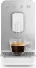 A close-up studio shot of a white and silver SMEG coffee machine with a cup of espresso. Voir les images du produit