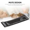A keyboard is shown in the foreground with a blurred background of a person and a dog sleeping. Voir les images du produit