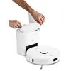 A person's hands are shown inserting a dust bag into a white charging and emptying station for a robot vacuum cleaner. The robot vacuum cleaner itself is visible in the foreground. Produktbild-Vorschau