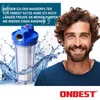 A man is smiling next to a water filter with water splashing around it. Produktbild-Vorschau