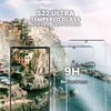 A scenic view of a coastal town with a smartphone screen protector superimposed. Produktbild-Vorschau