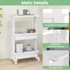 A white 3-tier rolling cart with various items on its shelves, shown with close-up insets highlighting its features. Produktbild-Vorschau