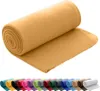 A rolled-up fleece blanket is shown against a white background. Below the main blanket, a row of similarly rolled blankets in various colors is visible. Náhľad obrázku produktu