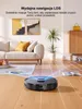A robotic vacuum cleaner is shown on a wooden floor, with blue laser lines projecting from it, illustrating its mapping and navigation capabilities in a living room setting. Podgląd zdjęcia produktu