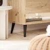 Close-up of the legs and bottom shelf of a wooden TV stand. Produktbild-Vorschau