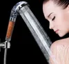 A woman showering with a handheld showerhead. Anteprima dell’immagine prodotto
