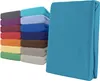 A stack of folded fitted sheets in various colors, with one teal sheet prominently displayed in the foreground. Produktbild-Vorschau