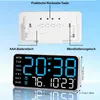 A digital clock is shown with its back and front displayed, along with dimensions and feature callouts. Produktbild-Vorschau