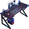 A gaming desk setup with a computer, monitor, keyboard, and accessories, illuminated by RGB lighting. Náhled obrázku produktu