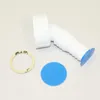 A white plastic plumbing fitting with a blue cap and a tan washer are laid out on a white surface. Produktbild-Vorschau