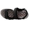 Das Bild zeigt einen schwarzen Sandalen aus Leder mit mehreren Riemen die sich über den Fuß ziehen. Die Sandalen sind von der linken Seite abgebildet und stehen auf einem hellen Untergrund. Produktbild-Vorschau
