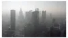 A hazy aerial view of a modern city skyline with numerous skyscrapers. Produktbild-Vorschau