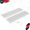 Two white ventilation grilles are placed on a blueprint background, with a few screws in the foreground. Anteprima dell’immagine prodotto
