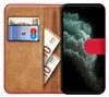 A book-style phone case is open, showing a credit card and euro banknotes in the card slots, and a smartphone with a green wallpaper in the phone holder. Podgląd zdjęcia produktu