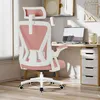 A pink and white ergonomic office chair is shown in a home office setting. Produktbild-Vorschau