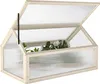 A wooden greenhouse with a clear, ribbed plastic cover, containing plants. Voir les images du produit