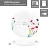 A marketing image showing a white porcelain plate with a floral design, along with dimensions and icons indicating suitability for microwave, refrigerator, and dishwasher. Produktbild-Vorschau