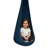 A young child sits in a dark blue hanging chair. Anteprima dell’immagine prodotto