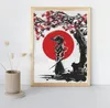 A framed painting of a samurai under a cherry blossom tree with a red sun in the background, displayed on a shelf next to a vase of dried flowers. Podgląd zdjęcia produktu