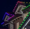 Christmas lights on the roof of a house at night. Náhled obrázku produktu
