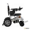 A side view of a silver and black electric wheelchair on a white background. Náhľad obrázku produktu
