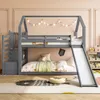 A child's bedroom with a grey bunk bed with a slide and stairs, decorated with string lights and a rug. Produktbild-Vorschau