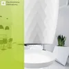 A split image showing a modern kitchen interior on the left and a white geometric planter with a snake plant on the right. Podgląd zdjęcia produktu
