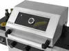 A close-up view of a stainless steel gas grill with a glass window showing food inside. Produktbild-Vorschau
