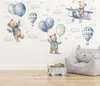 A nursery or child's room wall decorated with watercolor-style wall stickers of teddy bears, balloons, hot air balloons, and stars. Anteprima dell’immagine prodotto