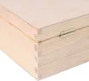 A close-up view of the corner of a wooden box, showing the dovetail joints and a metal hinge. Produktbild-Vorschau
