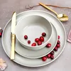 A table setting with plates, a bowl, cutlery, and cranberries. Náhľad obrázku produktu