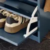 Close-up of a shoe rack with shoes on it. Náhľad obrázku produktu