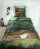 A child's bed with Jurassic World themed bedding, including a duvet cover and pillow. Produktbild-Vorschau