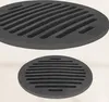 Two black cast iron grates are shown against a light beige background. The top grate is larger and angled, while the bottom grate is smaller and viewed from a slightly elevated angle. Anteprima dell’immagine prodotto