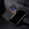 A black flip-style phone case with card slots and a bill compartment, shown open with a phone inside. Produktbild-Vorschau