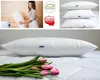 A collage of images showing pillows, a woman holding a pillow, and certifications. Produktbild-Vorschau