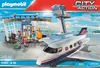 Playmobil airport playset with airplane and control tower on a blue and white background. Produktbild-Vorschau