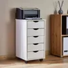 A white roll container with five drawers is placed next to a wooden shelf unit, with a printer on top of the container. Produktbild-Vorschau