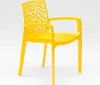 A yellow plastic chair with a web-like design on the back and seat, shown against a white background. Produktbild-Vorschau