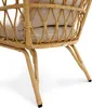 Close-up view of the legs and underside of a wicker chair with a beige cushion. Náhľad obrázku produktu