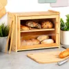 A bamboo bread box filled with various types of bread, placed on a kitchen counter. Náhled obrázku produktu