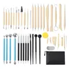 A collection of pottery and clay sculpting tools laid out on a white background. Produktbild-Vorschau