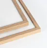 Two wooden picture frames are shown from a close-up angle on a white background. Anteprima dell’immagine prodotto